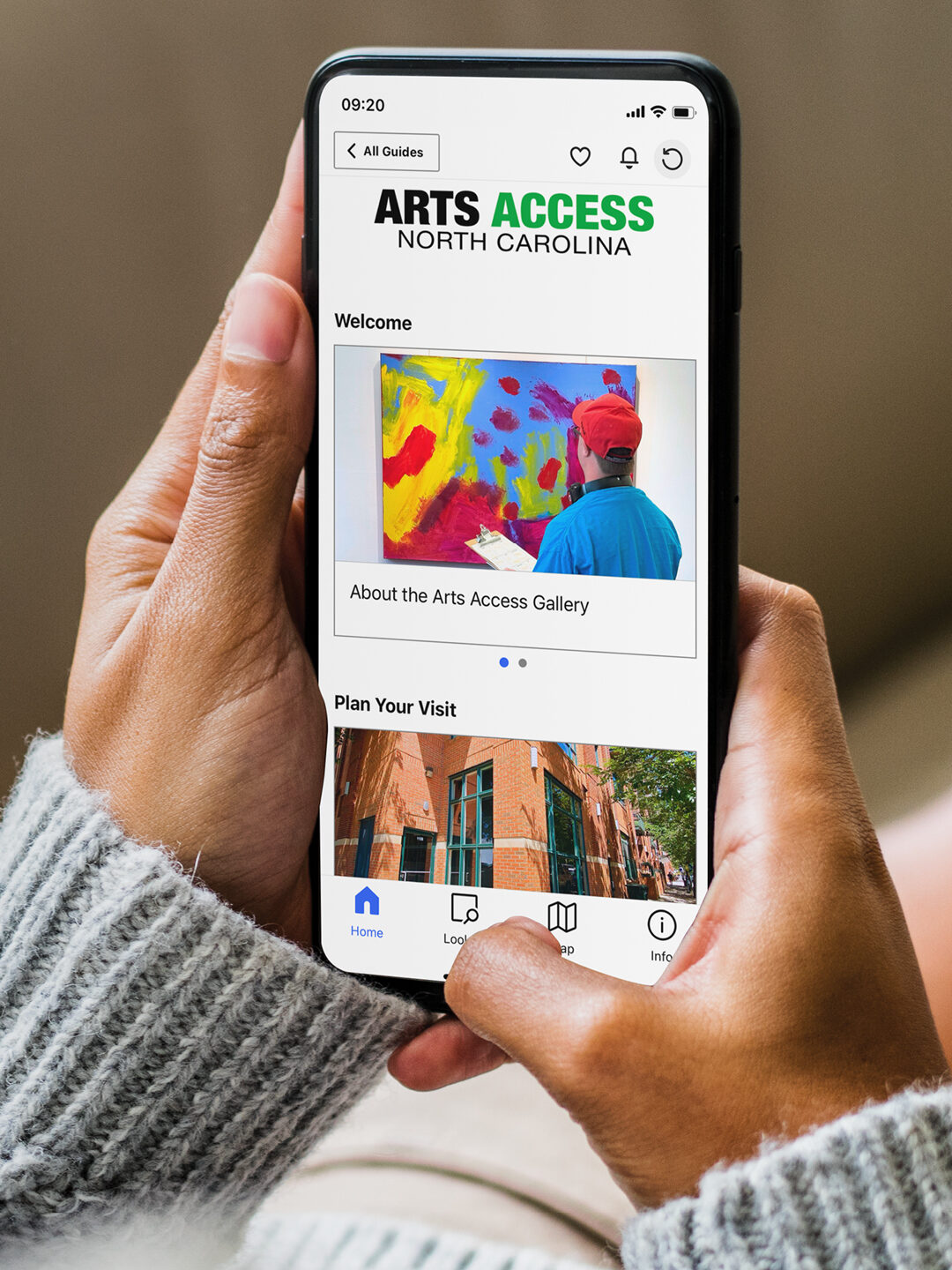 Hands holding a smart phone displaying the Arts Access Gallery guide on the Bloomberg Connects app.