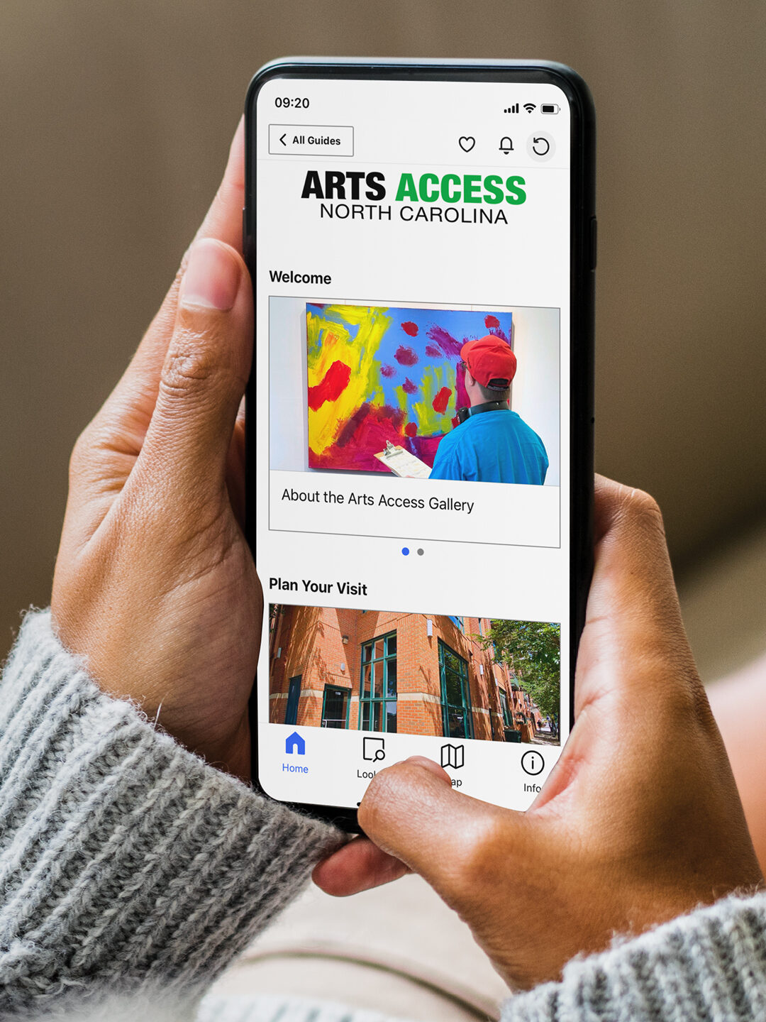 Hands holding a smart phone displaying the Arts Access Gallery guide on the Bloomberg Connects app